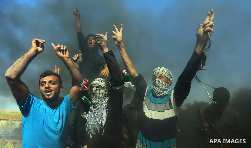 Palestinian protesters clash with Israeli security forces during a demonstration near the border with Israel, east of Khan Yunis, in the southern Gaza Strip on March 31, 2018. The UN Security Council heard fears of a fur...
