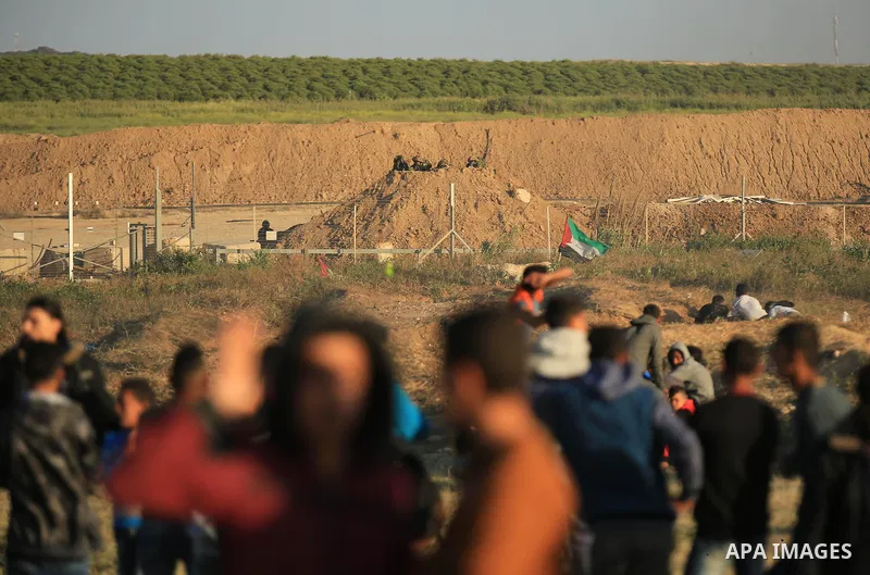 Palestinian protesters gather during a protest along the border with Israel, east of Gaza City on March 31, 2018. The UN Security Council heard fears of a further escalation in Israeli-Palestinian violence in the Gaza St...