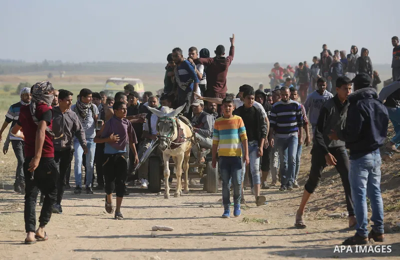 Palestinian protesters clash with Israeli security forces during a demonstration near the border with Israel, east of Khan Yunis, in the southern Gaza Strip on March 31, 2018. The UN Security Council heard fears of a fur...