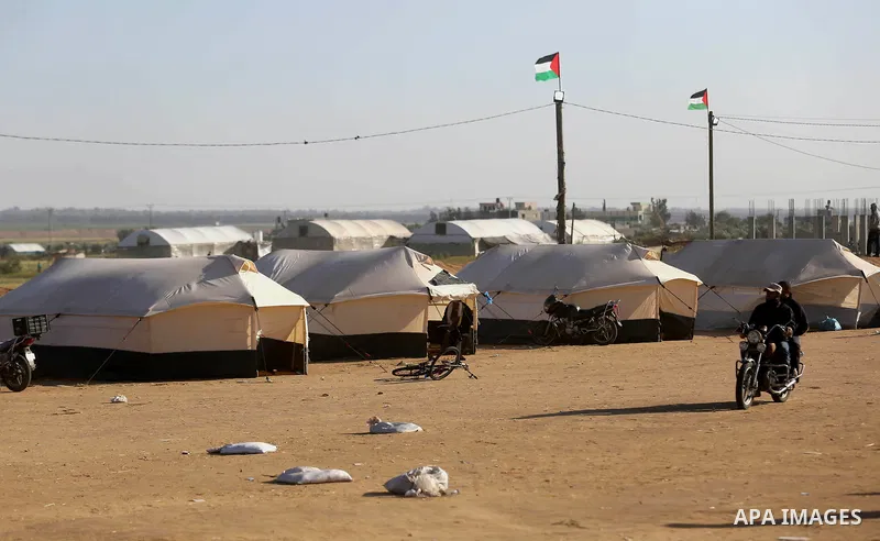 Palestinians take part during a tent city protest along the border with Israel, east of Khan Yunis, in the southern Gaza Strip on March 31, 2018. The UN Security Council heard fears of a further escalation in Israeli-Pal...