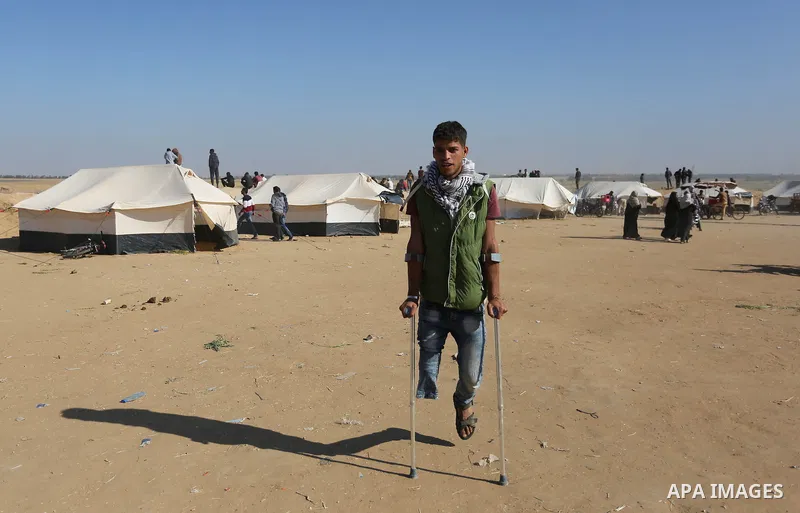 Palestinians take part during a tent city protest along the border with Israel, east of Khan Yunis, in the southern Gaza Strip on March 31, 2018. The UN Security Council heard fears of a further escalation in Israeli-Pal...