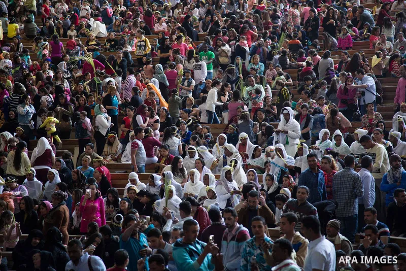 Egyptian Orthodox Christians take part in a mass marking the Palm Sunday at a church in Saint Samaan the tanner Monastery in Cairo on April 1, 2018. Photo by Stringer