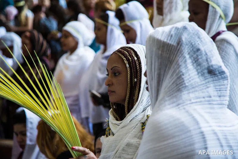 Egyptian Orthodox Christians take part in a mass marking the Palm Sunday at a church in Saint Samaan the tanner Monastery in Cairo on April 1, 2018. Photo by Stringer