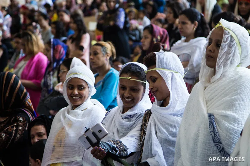 Egyptian Orthodox Christians take part in a mass marking the Palm Sunday at a church in Saint Samaan the tanner Monastery in Cairo on April 1, 2018. Photo by Stringer