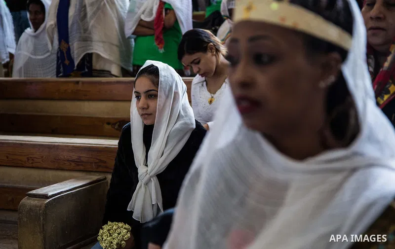 Egyptian Orthodox Christians take part in a mass marking the Palm Sunday at a church in Saint Samaan the tanner Monastery in Cairo on April 1, 2018. Photo by Stringer