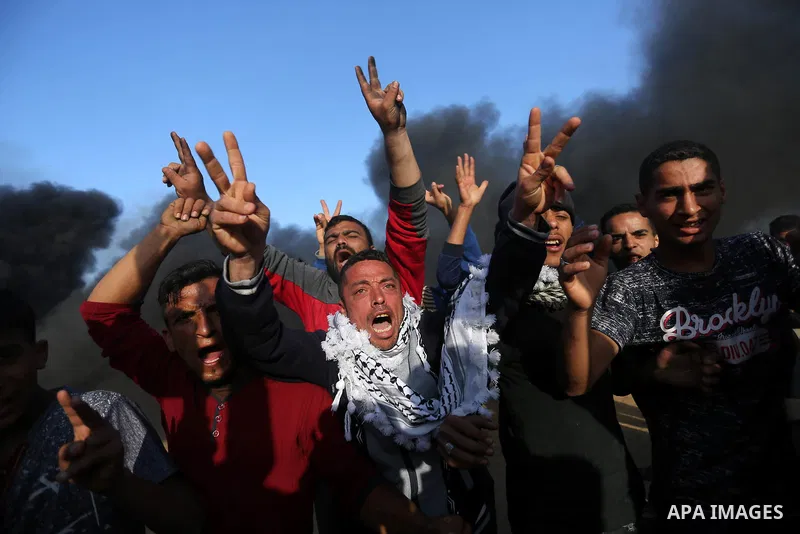 Palestinian protesters demonstrate during clashes with Israeli security forces in a protest, at the Israel-Gaza border, demanding the right to return to their homeland, in Khan Younis in the southern Gaza strip on April...