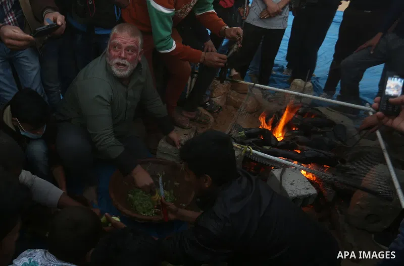 Palestinian protesters prepare dinner during clashes with Israeli security forces in a protest, at the Israel-Gaza border, demanding the right to return to their homeland, in Khan Younis in the southern Gaza strip on Apr...