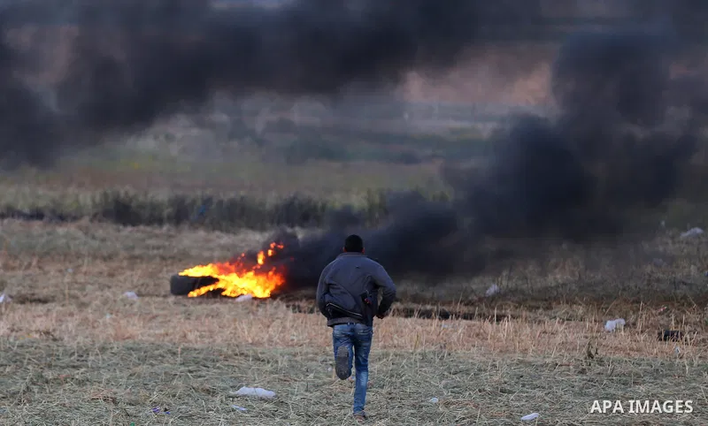 Palestinian protesters demonstrate during clashes with Israeli security forces in a protest, at the Israel-Gaza border, demanding the right to return to their homeland, in Khan Younis in the southern Gaza strip on April...