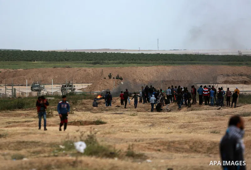 Palestinians take part in a tent city protest along the Israel border with Gaza, demanding the right to return to their homeland, in the east of Gaza city on April 3, 2018. Photo by Mohammed Dahman