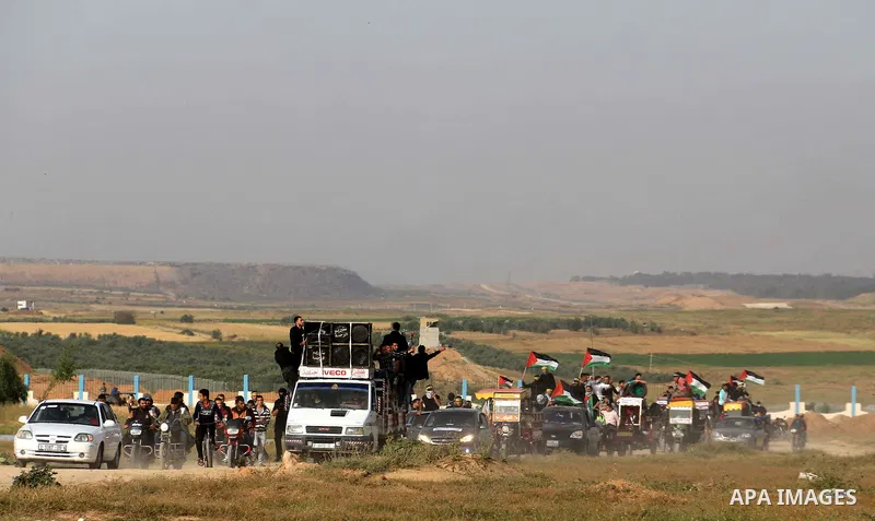 Palestinian protesters bring old tires with pickup trucks as they take part in a demonstration demanding the right of return and removal of the blockade following the "Great March of Return" in Bureij, Gaza on April 05,...