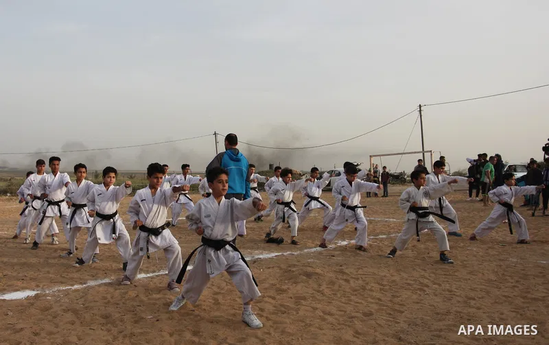Palestinian children play Karate near to the site of clashes between Palestinian demonstrators and Israeli security forces following a protest along the Gaza-Israel border, east of Gaza City on April 5, 2018. Palestinian...