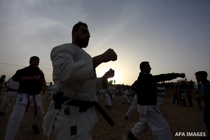 Palestinian children play Karate near to the site of clashes between Palestinian demonstrators and Israeli security forces following a protest along the Gaza-Israel border, east of Gaza City on April 5, 2018. Palestinian...