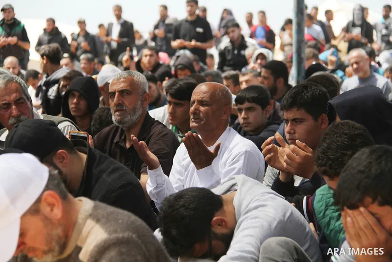 Palestinian Muslim worshippers perform Friday noon prayers during a tent city protest along the Israel border with Gaza, demanding the right to return to their homeland, in Jabalia in the northern of Gaza strip on April...