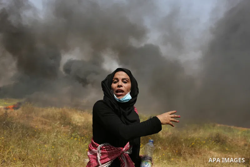 Palestinian protesters burn tires to protect themselves from shots of Israeli soldiers during clashes in a tent city protest at the Israel-Gaza border, demanding the right to return to their homeland, in Khan Younis in t...