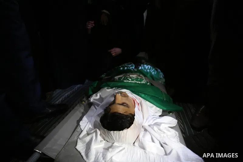 Relatives mourn over the body of Alaa al-Zamili, 15, who who died the day before during clashes with Isareli security forces at the Israel-Gaza border, during his funeral in Rafah in the southern Gaza strip on April 7, 2...