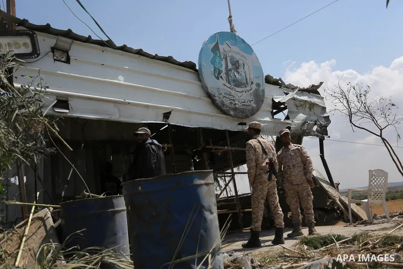 Members of Hamas movement's security apparatus inspect the site targeted by Israeli tank fire on the outskirts of Gaza City, near the border with Israel, on April 11, 2018. Israeli tanks shelled sites in eastern Gaza Cit...