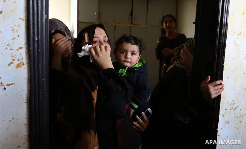 Female relatives of Islam Herzallah, 28, who was killed during clashes with Israeli security forces at the Israel-Gaza border, mourn during his funeral in Gaza City on April 14, 2018. Photo by Ashraf Amra