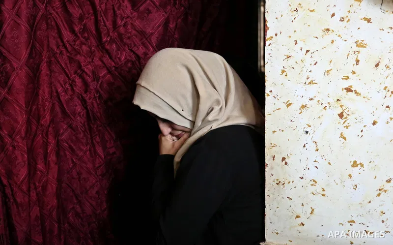 Female relatives of Islam Herzallah, 28, who was killed during clashes with Israeli security forces at the Israel-Gaza border, mourn during his funeral in Gaza City on April 14, 2018. Photo by Ashraf Amra