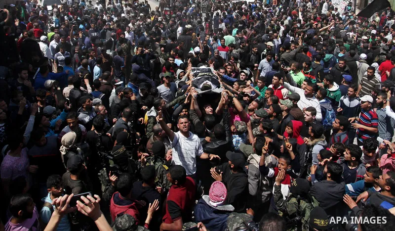 Palestinian mourners attend the funeral of Islamic Jihad militants who were killed in an explosion in the previous day, in Rafah in the southern Gaza Strip on April 15, 2018. Islamic Jihad's armed wing, in a statement, s...