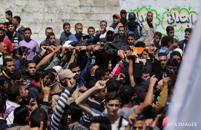 Palestinian mourners attend the funeral of Islamic Jihad militants who were killed in an explosion in the previous day, in Rafah in the southern Gaza Strip on April 15, 2018. Islamic Jihad's armed wing, in a statement, s...