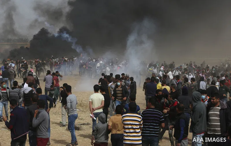 Palestinian protesters burn tires during clashes with Israeli security forces at tents protest at the Israel-Gaza border where Palestinians demand the right to return to their homeland, in Khan Younis in the southern Gaz...