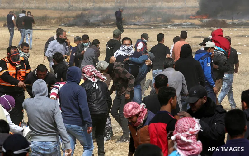 Palestinian protesters burn tires during clashes with Israeli security forces at tents protest at the Israel-Gaza border where Palestinians demand the right to return to their homeland, in Khan Younis in the southern Gaz...