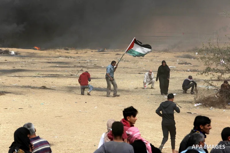 Palestinian protesters burn tires during clashes with Israeli security forces at tents protest at the Israel-Gaza border where Palestinians demand the right to return to their homeland, in Khan Younis in the southern Gaz...