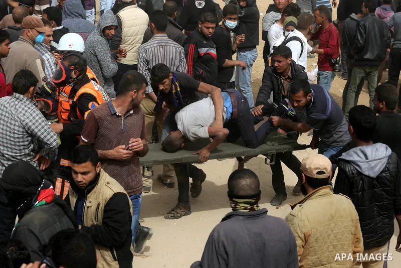 A wounded Palestinian protester is evacuated during clashes with Israeli security forces at tents protest at the Israel-Gaza border where Palestinians demand the right to return to their homeland, in Khan Younis in the s...