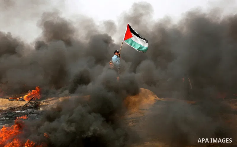 Palestinian protesters burn tires during clashes with Israeli security forces at tents protest at the Israel-Gaza border where Palestinians demand the right to return to their homeland, in Khan Younis in the southern Gaz...