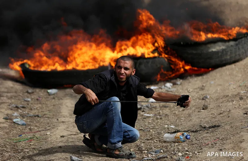 Palestinian protesters clash with Israeli security forces at tents protest at the Israel-Gaza border where Palestinians demand the right to return to their homeland, in east of Gaza city on April 20, 2018. Photo by Yasse...
