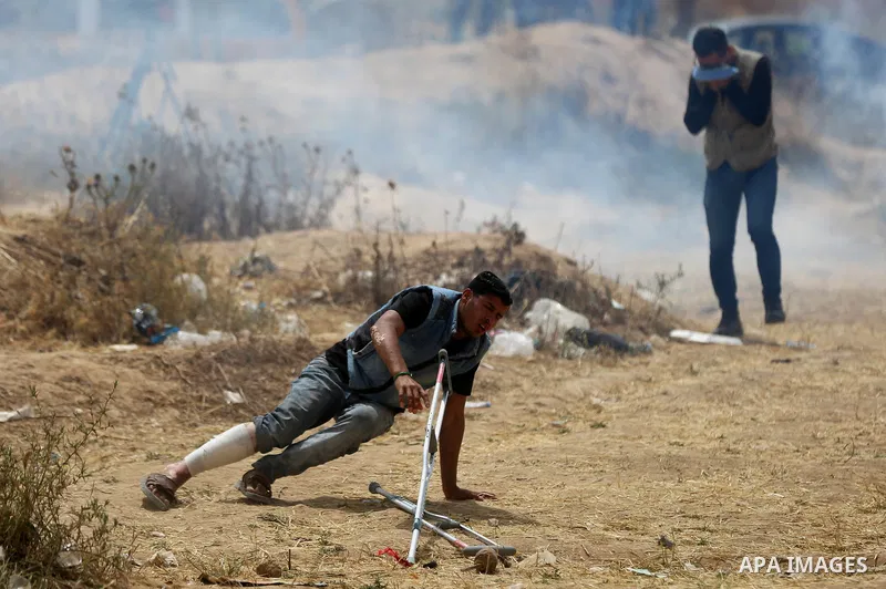 Palestinian protesters clash with Israeli security forces at tents protest at the Israel-Gaza border where Palestinians demand the right to return to their homeland, in east of Gaza city on April 20, 2018. Photo by Yasse...