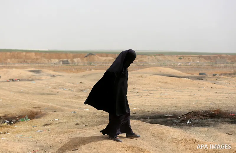 A Palestinian woman wearing veil takes part during clashes with Israeli security forces at tents protest at the Israel-Gaza border where Palestinians demand the right to return to their homeland, in east of Gaza city on...