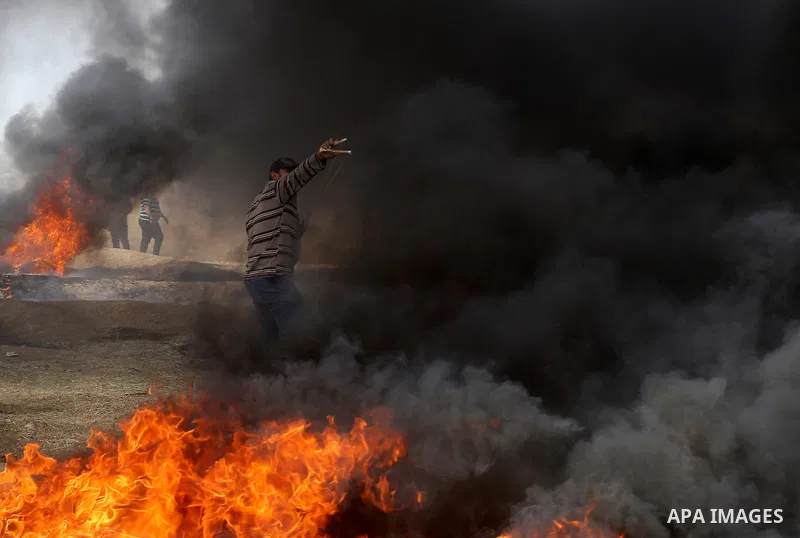 Palestinian protesters clash with Israeli security forces at tents protest at the Israel-Gaza border where Palestinians demand the right to return to their homeland, in east of Gaza city on April 20, 2018. Photo by Yasse...