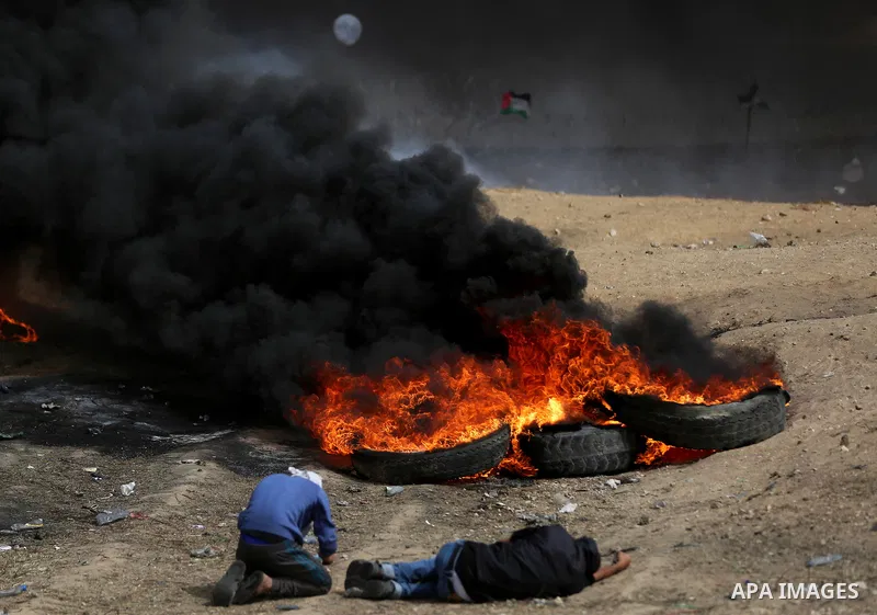 Palestinian protesters clash with Israeli security forces at tents protest at the Israel-Gaza border where Palestinians demand the right to return to their homeland, in east of Gaza city on April 20, 2018. Photo by Yasse...