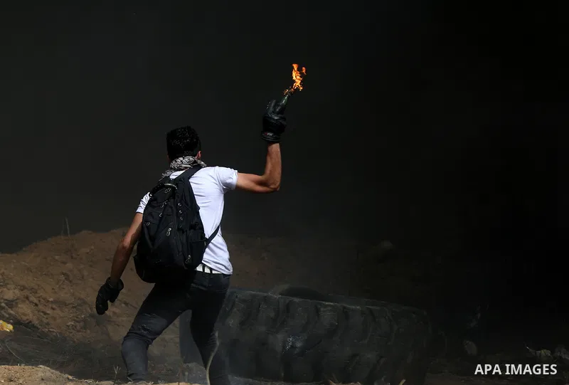 Palestinian protesters clash with Israeli security forces at tents protest at the Israel-Gaza border where Palestinians demand the right to return to their homeland, in east of Gaza city on April 20, 2018. Photo by Yasse...