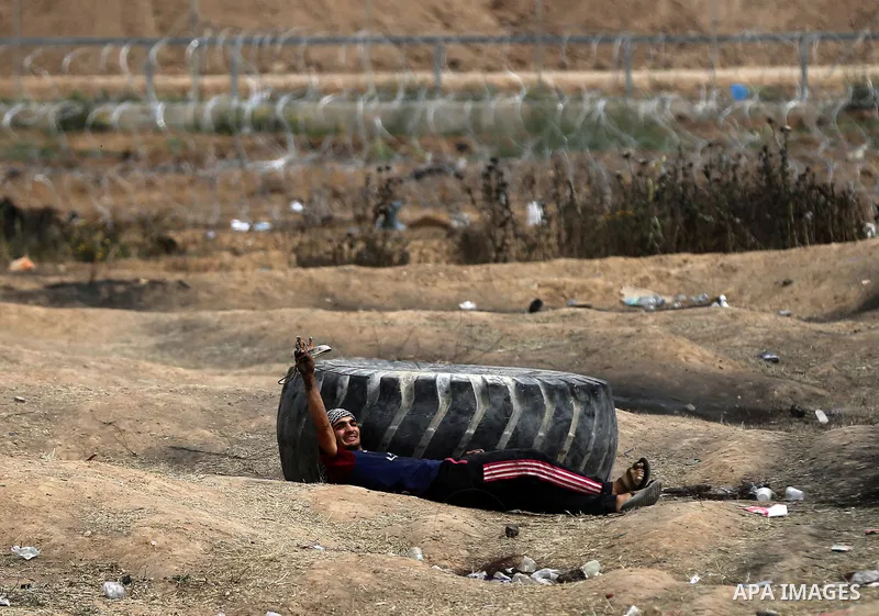 Palestinian protesters clash with Israeli security forces at tents protest at the Israel-Gaza border where Palestinians demand the right to return to their homeland, in east of Gaza city on April 20, 2018. Photo by Yasse...