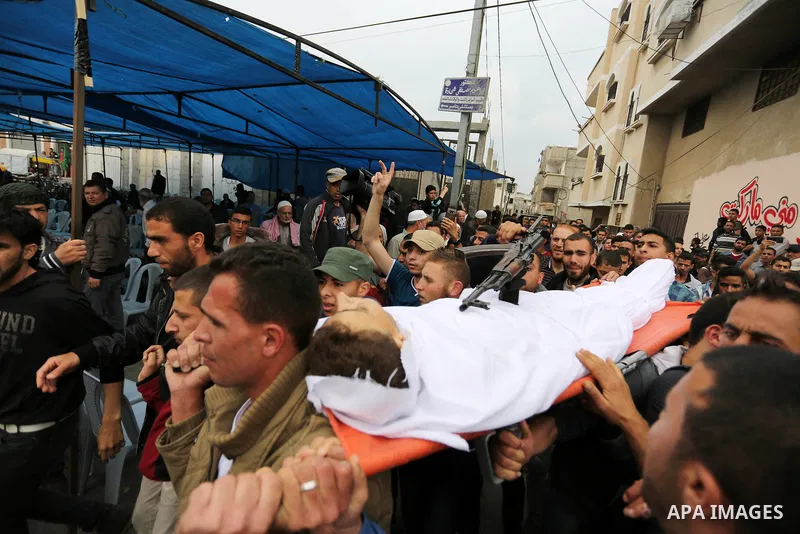 Palestinians carry the body of 29-year-old Saadi Abu Taha, who was killed at the Israel-Gaza border during clashes with Israeli security forces, during his funeral in Khan Yunis in the southern Gaza strip on April 21, 20...