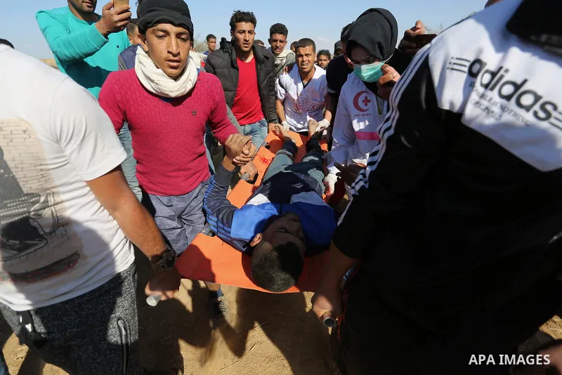 A wounded Palestinian protester is evacuated during clashes with Israeli security forces near the border fence with Israel near the southern Gaza Strip town of Khan Yunis during ongoing demonstrations on the Gaza-Israel...