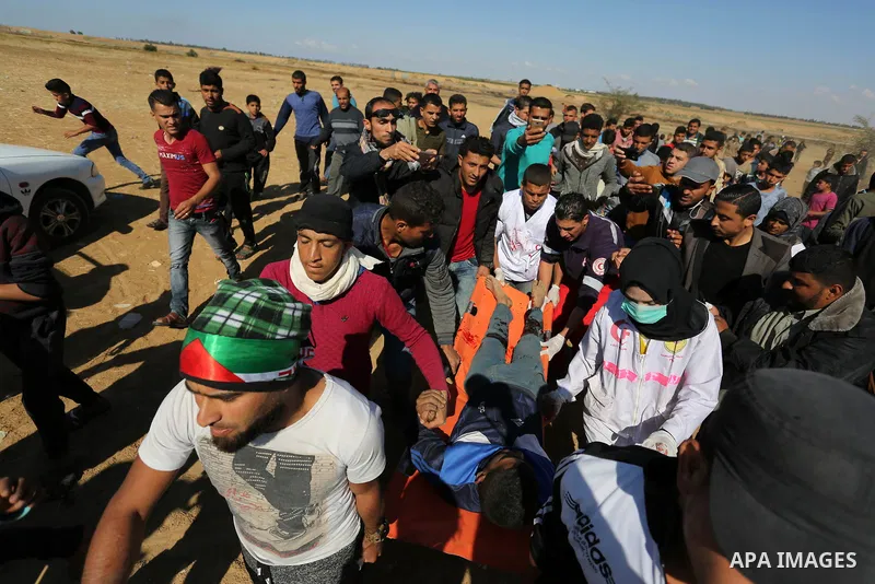 A wounded Palestinian protester is evacuated during clashes with Israeli security forces near the border fence with Israel near the southern Gaza Strip town of Khan Yunis during ongoing demonstrations on the Gaza-Israel...