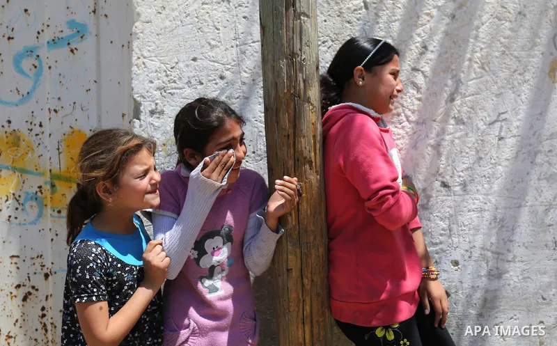 Palestinian children mourn during the funeral of a Palestinian deaf Tahreer Wahba, 18, who was died of from his injuries after being shot in the head by Israeli security forces during clashes on April 6, during his funer...