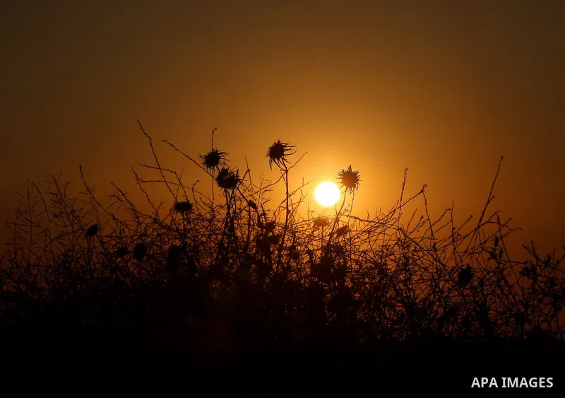 A picture taken on April 23, 2018 shows sunset near the Israel-Gaza border, east of Gaza city. Photo by Yasser Qudih