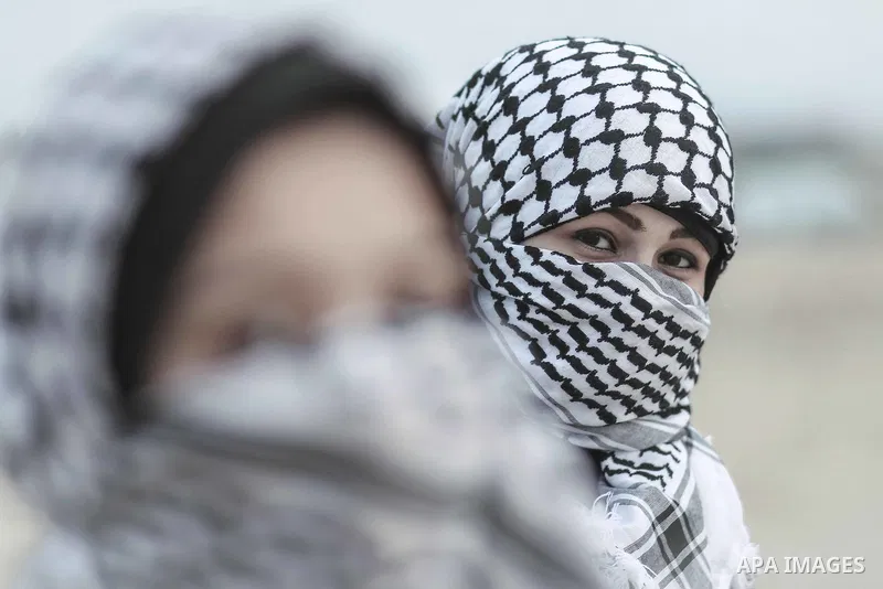 girls wearing Palestinian traditional checkered keffiyeh. Photo by Sanad Ltefa