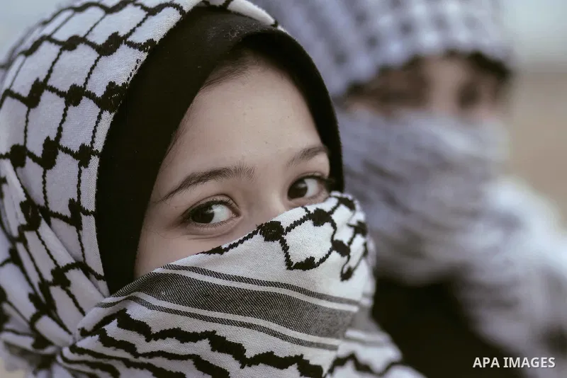 girls wearing Palestinian traditional checkered keffiyeh. Photo by Sanad Ltefa