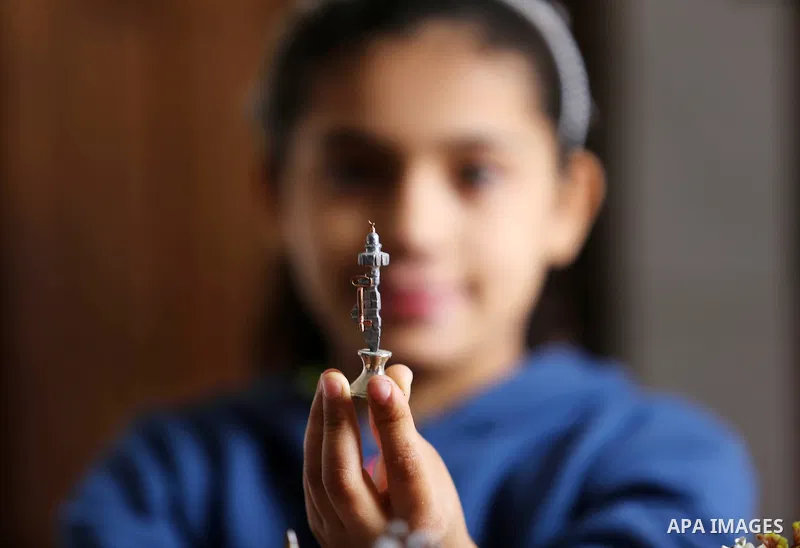 Palestinian artist Magdy Abu Takeya, 38, converts gunshots used by the Israeli security forces against Palestinian protesters to small pieces of art knows as "Art of thumbnails" at his house in Nuseirat in the central Ga...