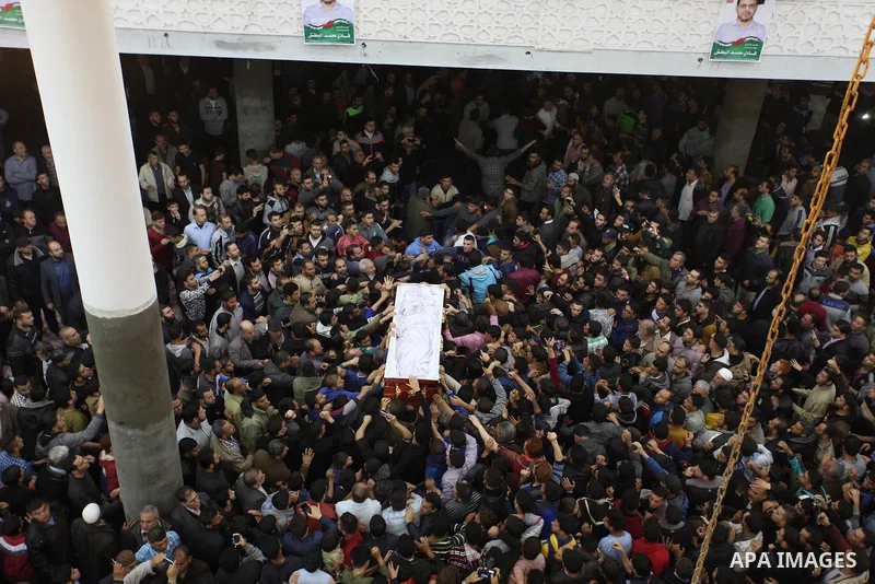 Palestinian mourners carry the body of Palestinian scientist Fadi al-Batsh, assassinated in Malaysia, during his funeral in the northern Gaza Strip, on April 26, 2018. after his body was returned to his homeland, a membe...