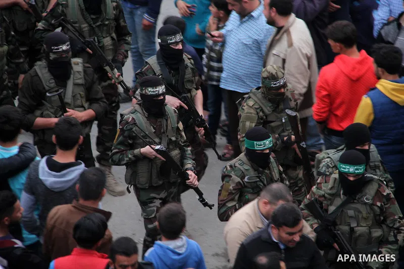 Palestinian mourners carry the body of Palestinian scientist Fadi al-Batsh, assassinated in Malaysia, during his funeral in the northern Gaza Strip, on April 26, 2018. after his body was returned to his homeland, a membe...