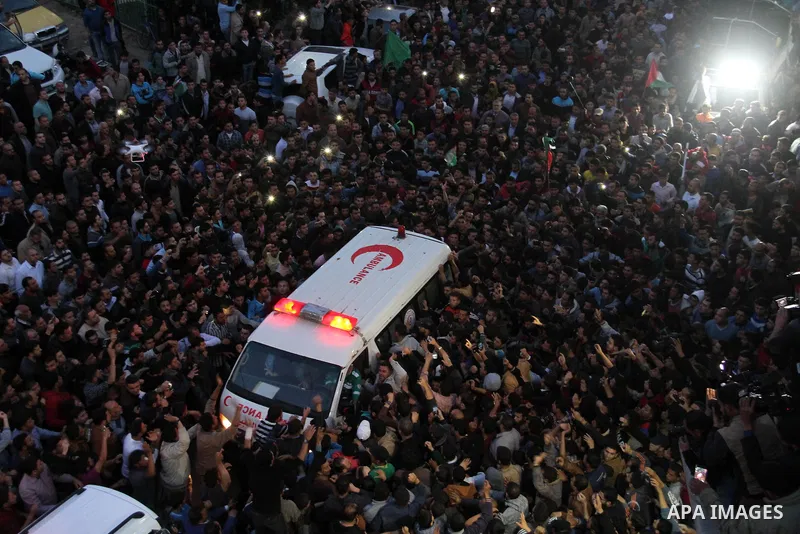 Palestinian mourners carry the body of Palestinian scientist Fadi al-Batsh, assassinated in Malaysia, during his funeral in the northern Gaza Strip, on April 26, 2018. after his body was returned to his homeland, a membe...