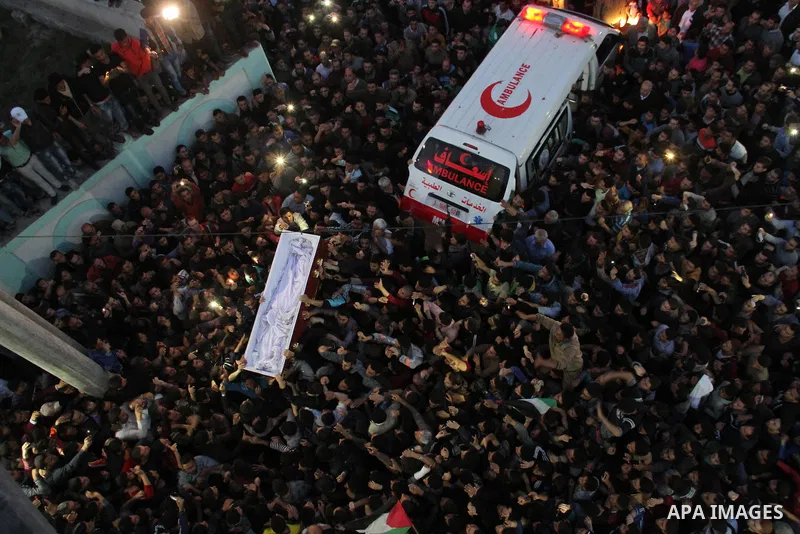 Palestinian mourners carry the body of Palestinian scientist Fadi al-Batsh, assassinated in Malaysia, during his funeral in the northern Gaza Strip, on April 26, 2018. after his body was returned to his homeland, a membe...