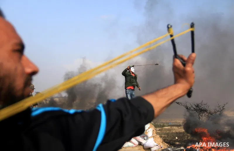 Palestinian protesters clash with Israeli security forces during tents protest demanding the right to return to their homeland, at the Israel-Gaza border, in Bureij in the cetner of Gaza strip on April 27, 2018. Photo by...