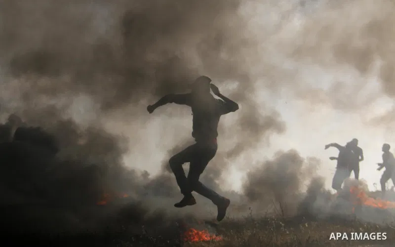 Palestinian protesters clash with Israeli security forces during tents protest demanding the right to return to their homeland, at the Israel-Gaza border, in Bureij in the cetner of Gaza strip on April 27, 2018. Photo by...